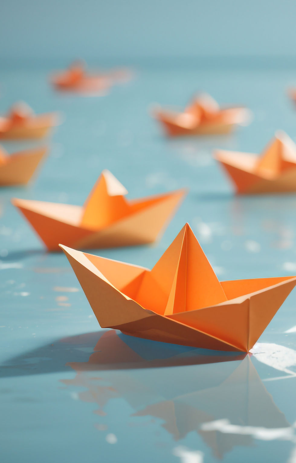 bold-independence-orange-paper-boat-floating-away-from-others-6.jpg